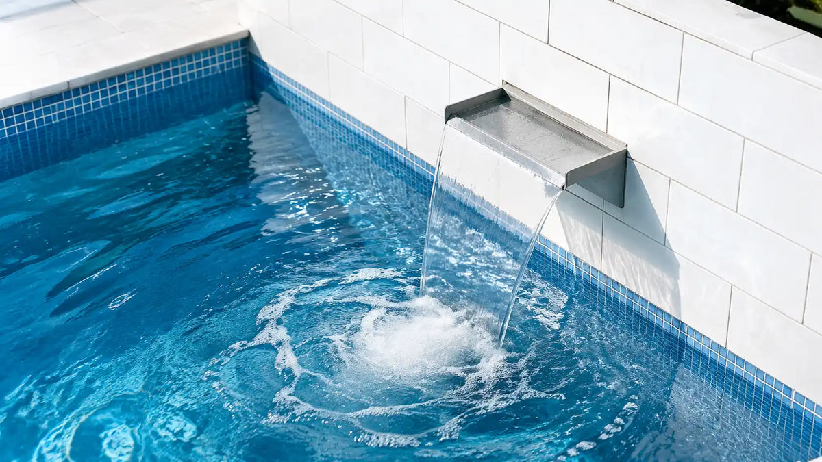 Small pond water feature using a compact solar fountain kit