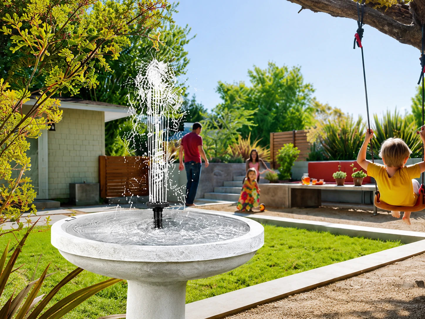 Solar bird bath fountain running in a garden with moving water